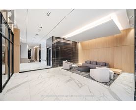 A modern living room with a marble floor and a wooden accent wall.