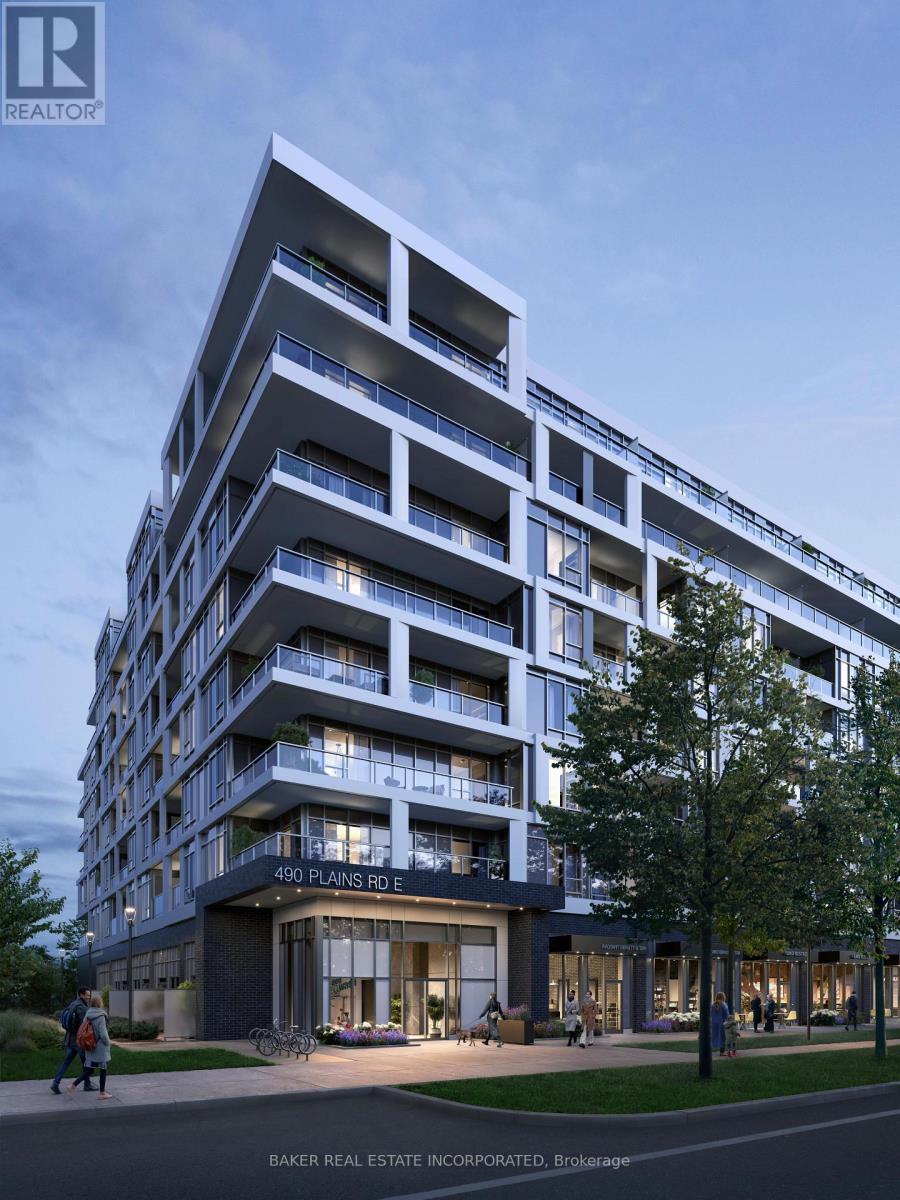 A modern apartment building with balconies and a glass entrance.