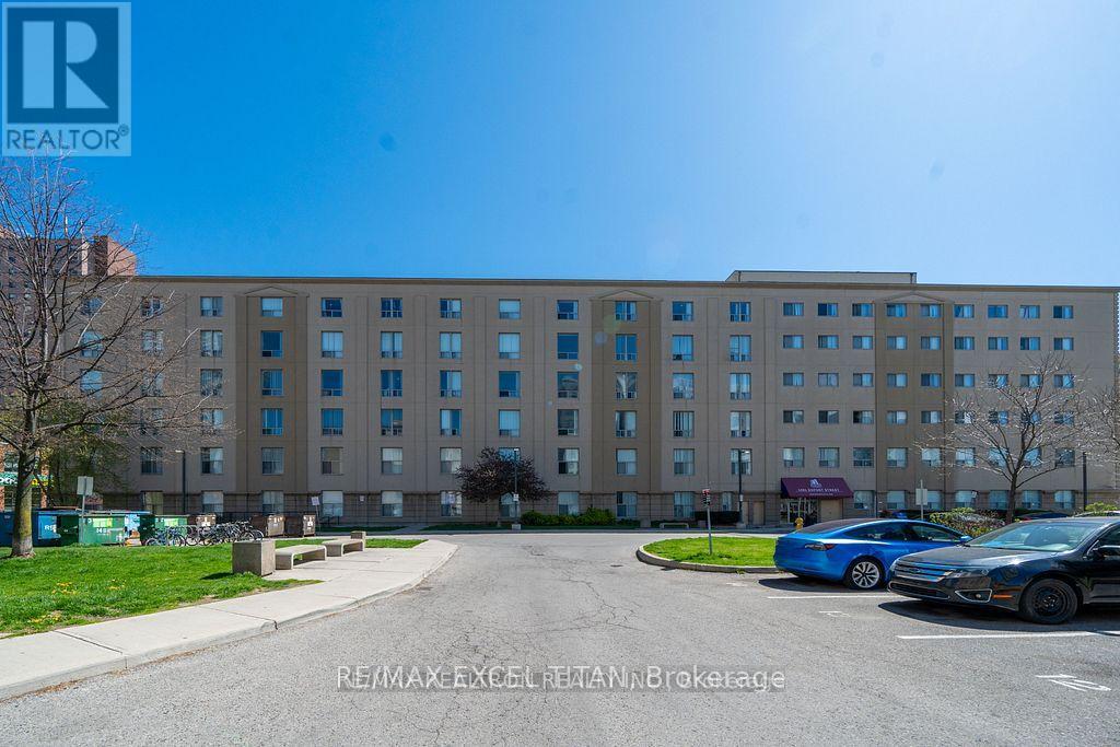 A large building with a parking lot in front of it.