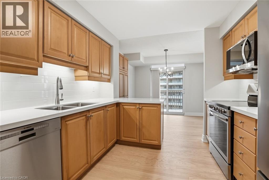 A kitchen with wooden cabinets and stainless steel appliances.