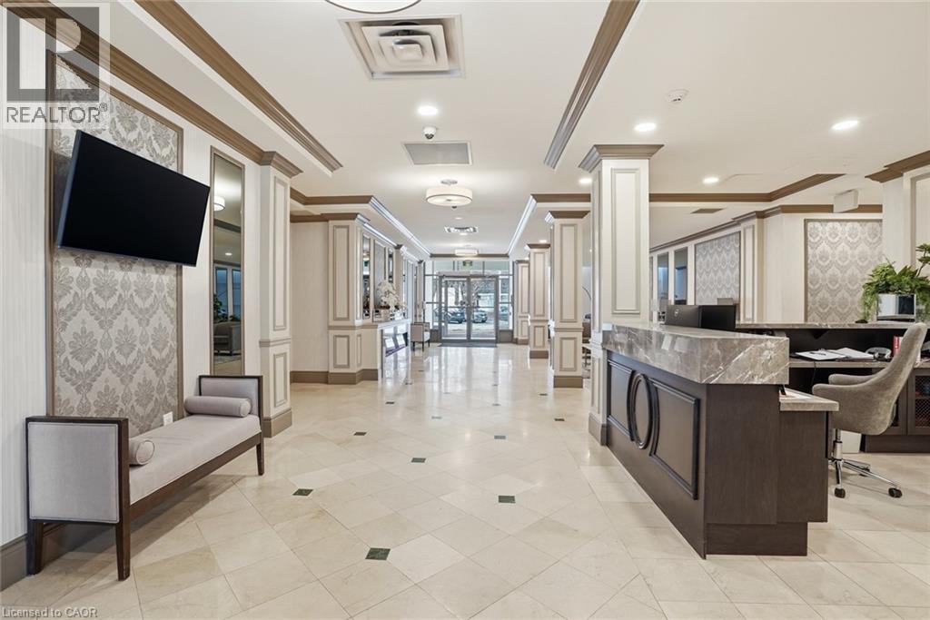A well-lit, spacious lobby with a reception desk and seating area.