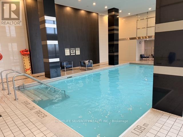 A swimming pool in a room with a sign that says REALTOR.