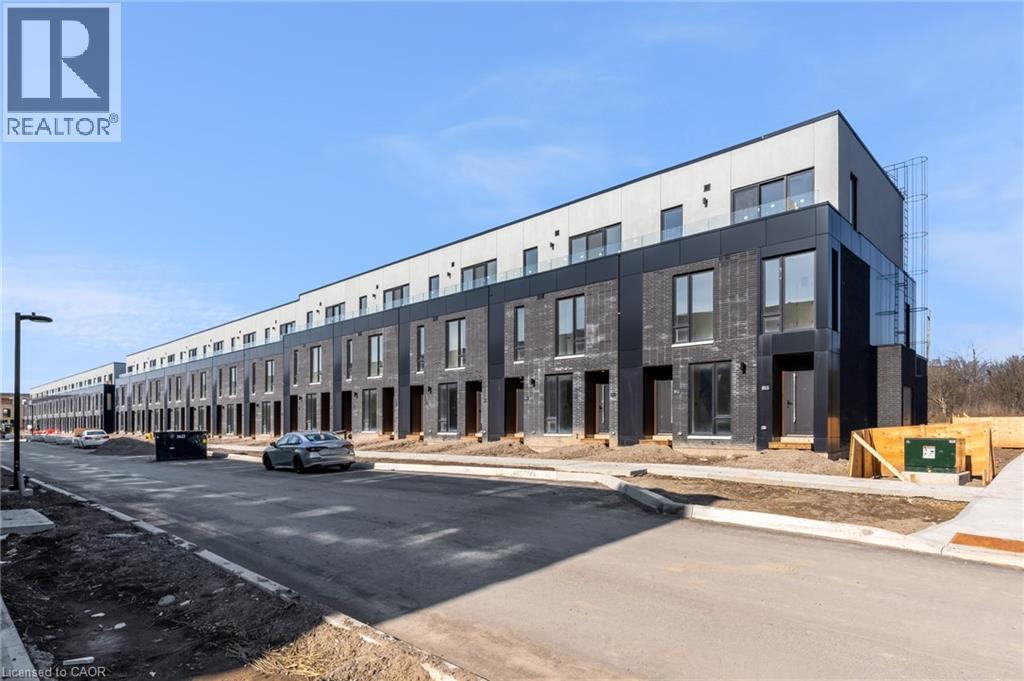 A modern building under construction with a REALTOR® logo.