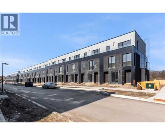 A modern building under construction with a REALTOR® logo.