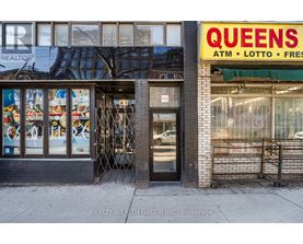 A Queens ATM, Lotto, and Fresh storefront on a city street.