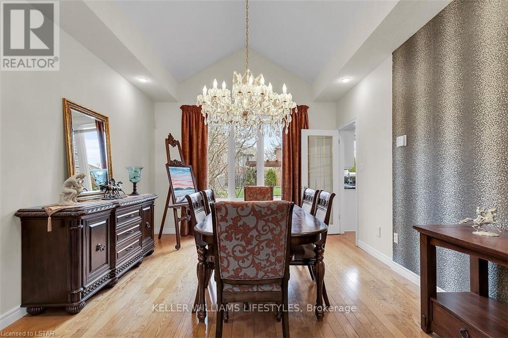 A dining room with a wooden table and chairs.