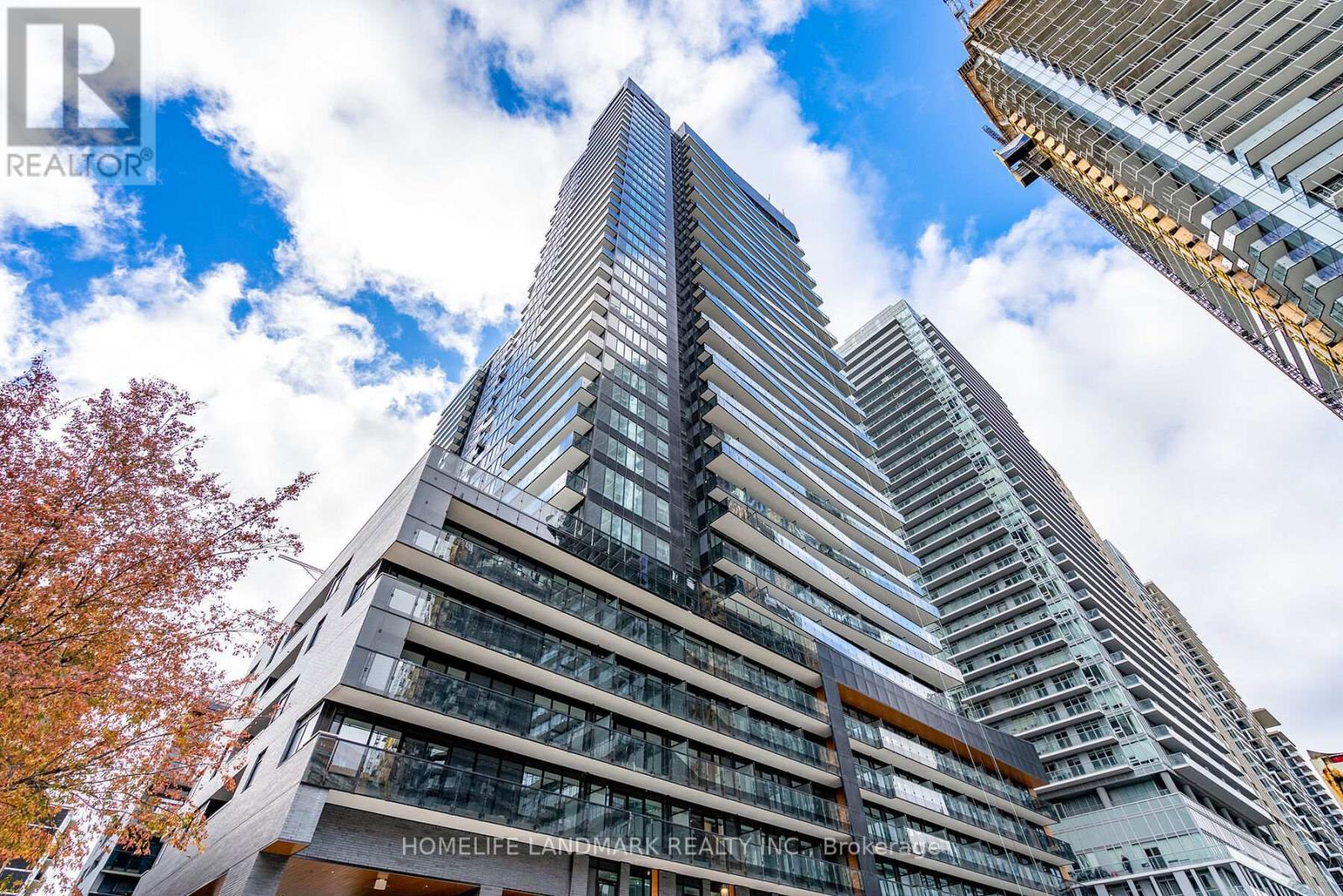 A tall building with the words "HOMELIFE LAWMARK REALTY INC." on the front.