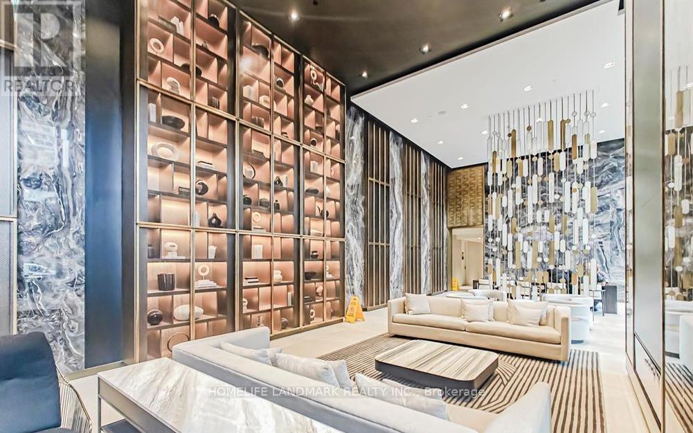 A modern living room with a large sofa and a wall of bottles.