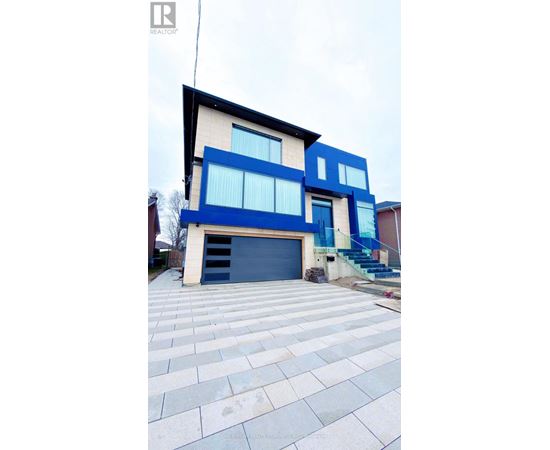 A modern house with a blue and white facade.