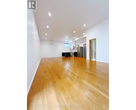 A room with wooden floors and white walls.