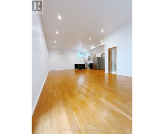 A room with wooden floors and white walls.