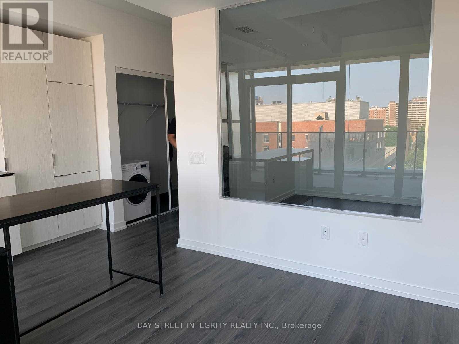 A room with a table and chairs in it.