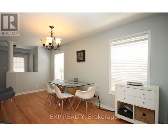 A dining room with a glass table and chairs.