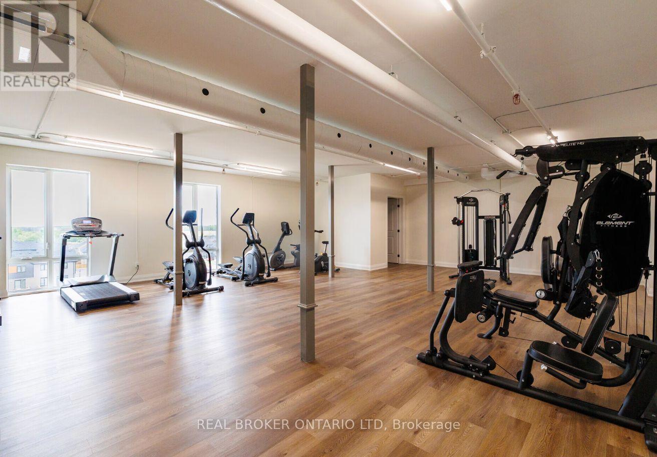 A gym with a variety of equipment including treadmills, stationary bikes, and weight machines.