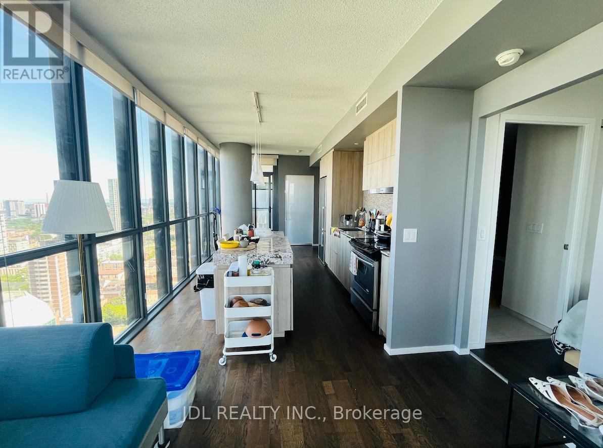 A well-lit kitchen and dining area with a view of the outdoors.