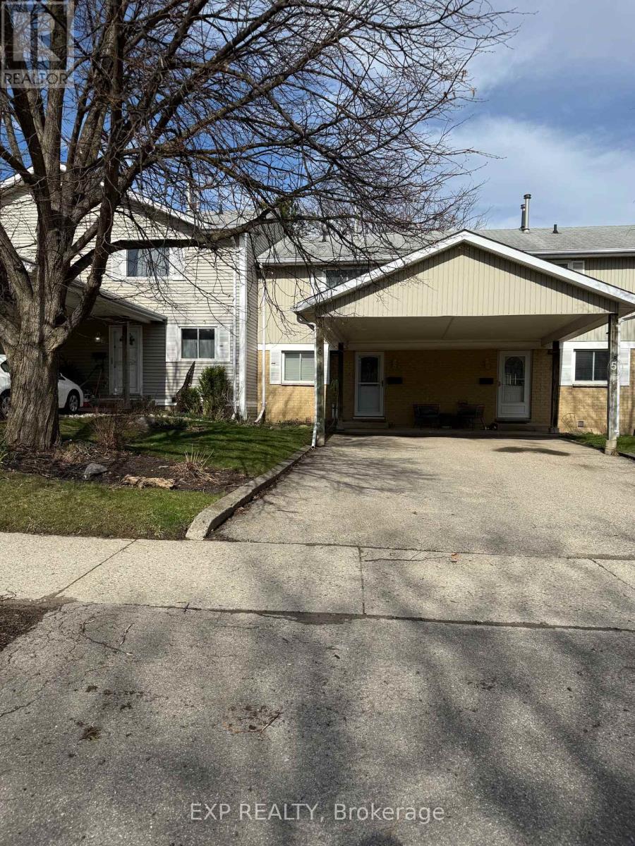 A house with a driveway in front of it.