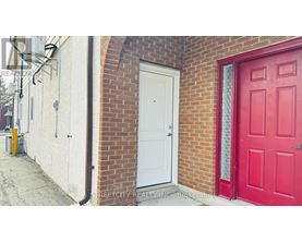 A red door is on the right side of a white door.