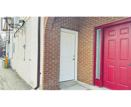 A red door is on the right side of a white door.