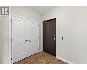 A room with a white door and a brown door.