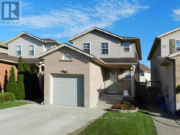 A house with a garage is for sale.
