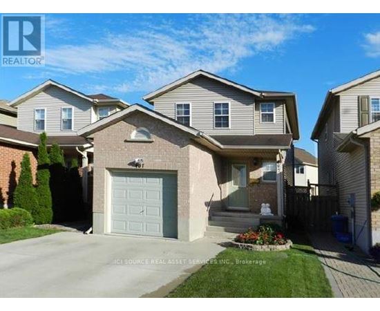 A house with a garage is for sale.
