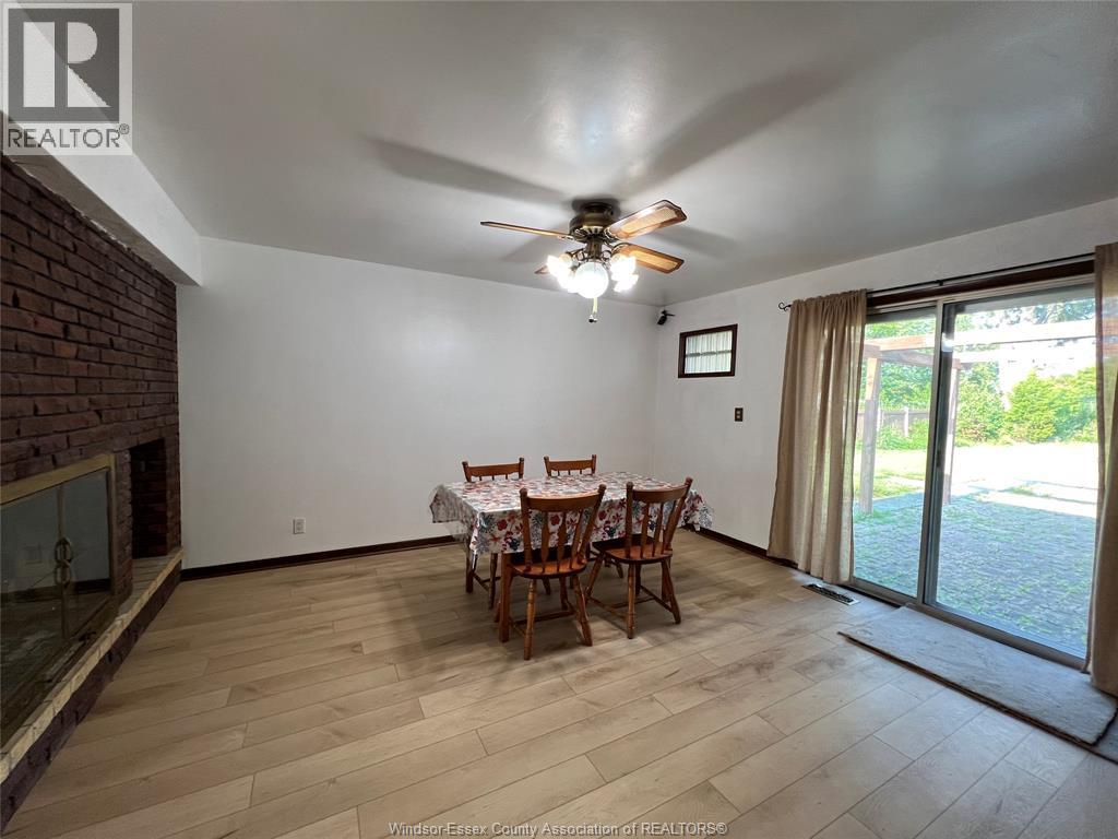 A dining room with a table set for four.