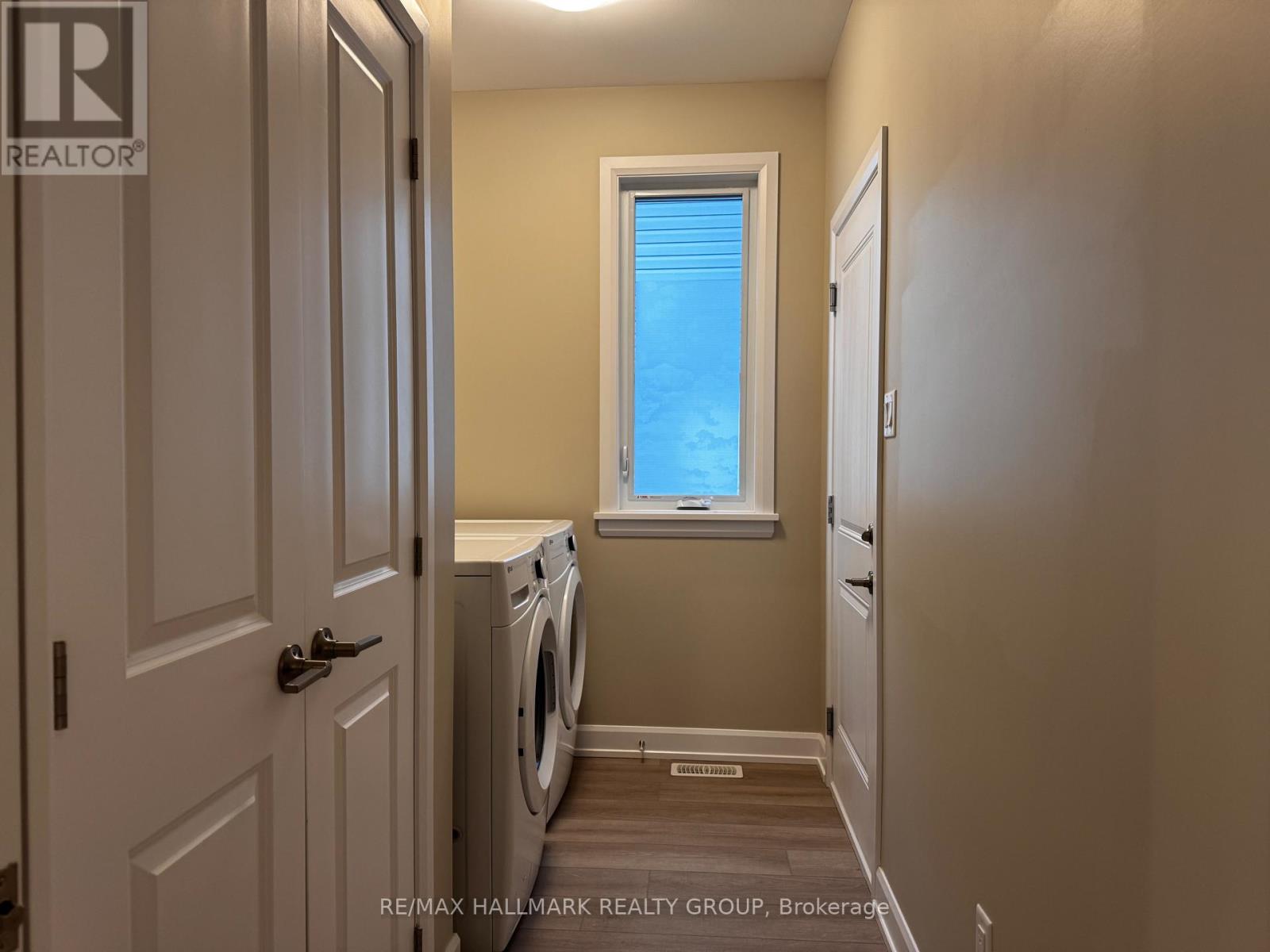 A laundry room with a washer and dryer.