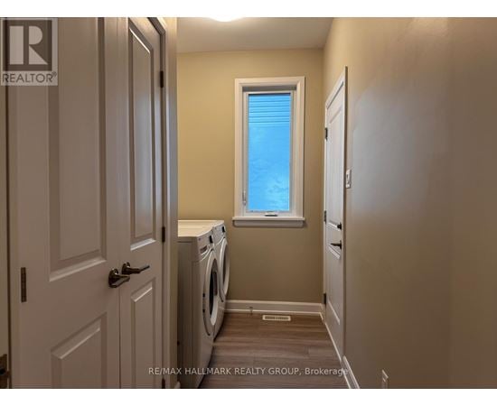 A laundry room with a washer and dryer.