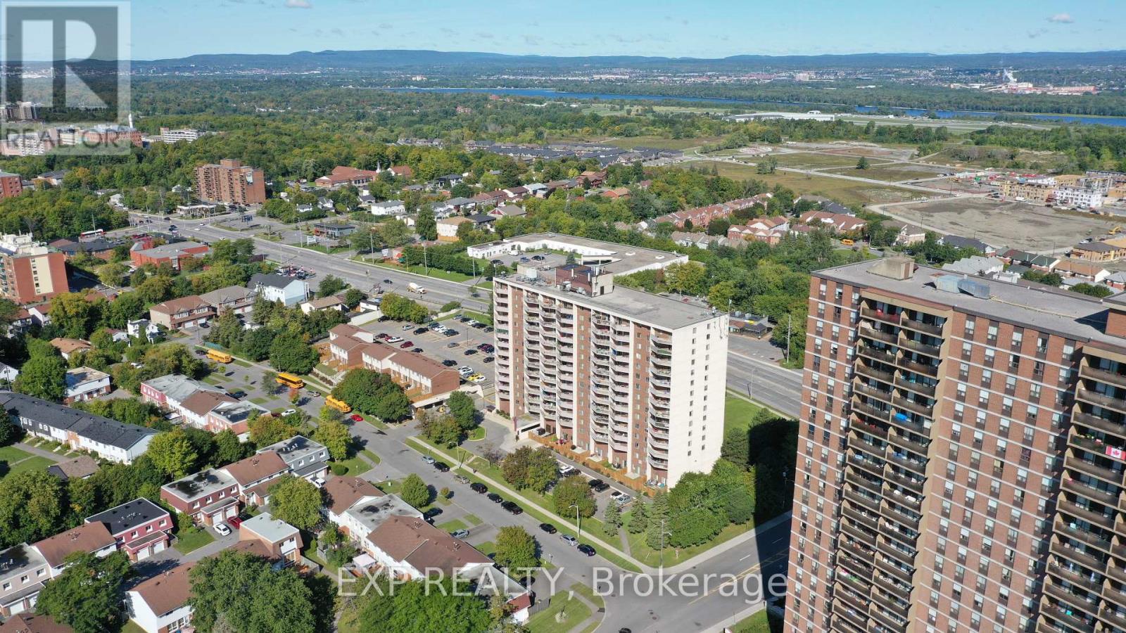 A cityscape with a mix of residential and commercial buildings.