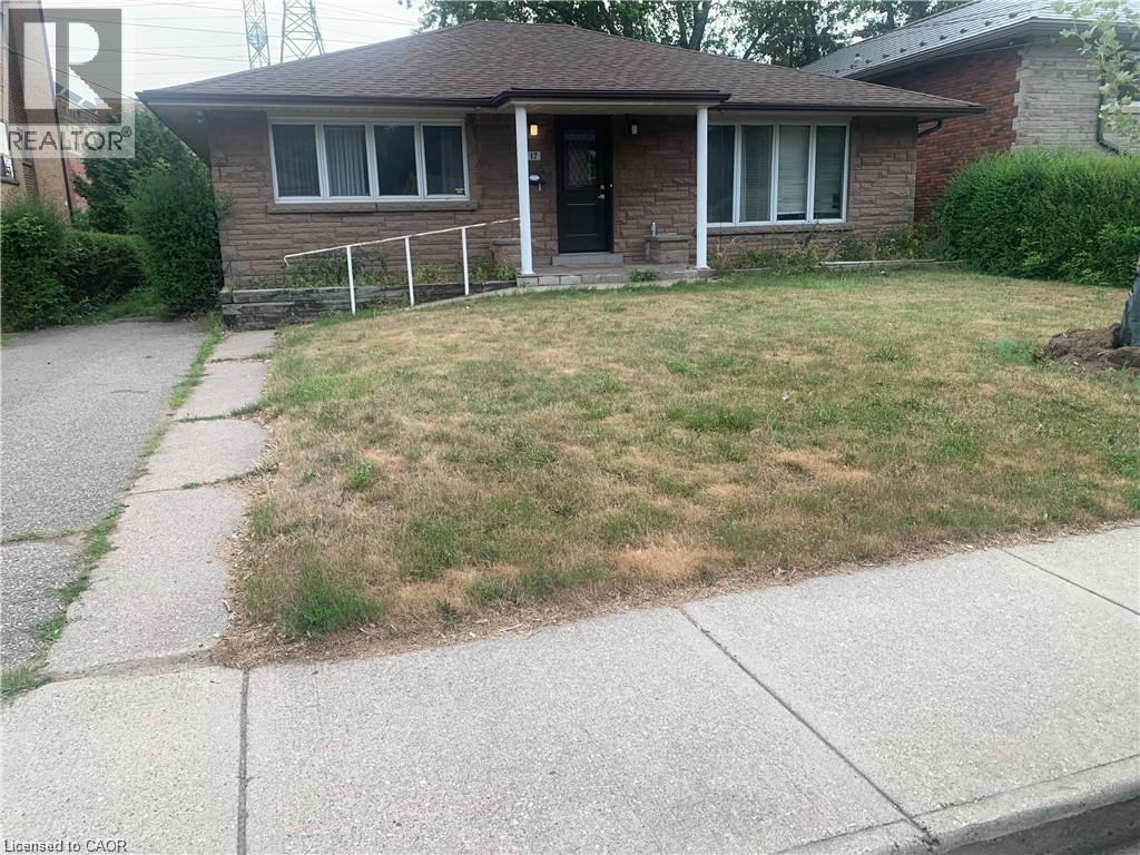 A house with a lawn in front of it.