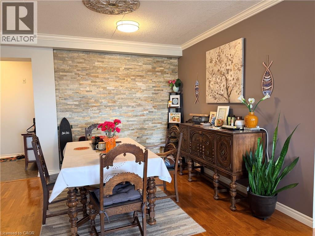 A dining room with a wooden table and chairs.