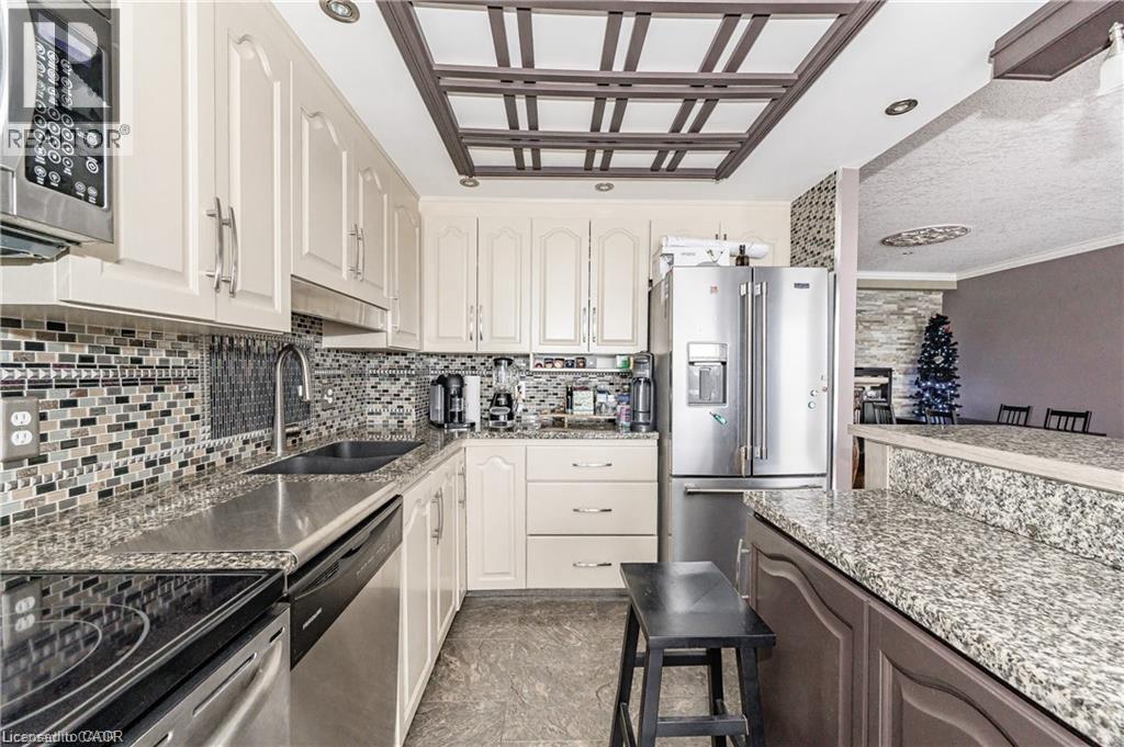A kitchen with a stove top oven and a microwave.