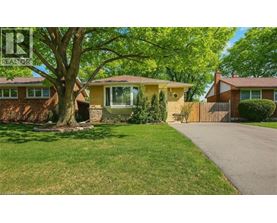 A house with a tree in front of it.