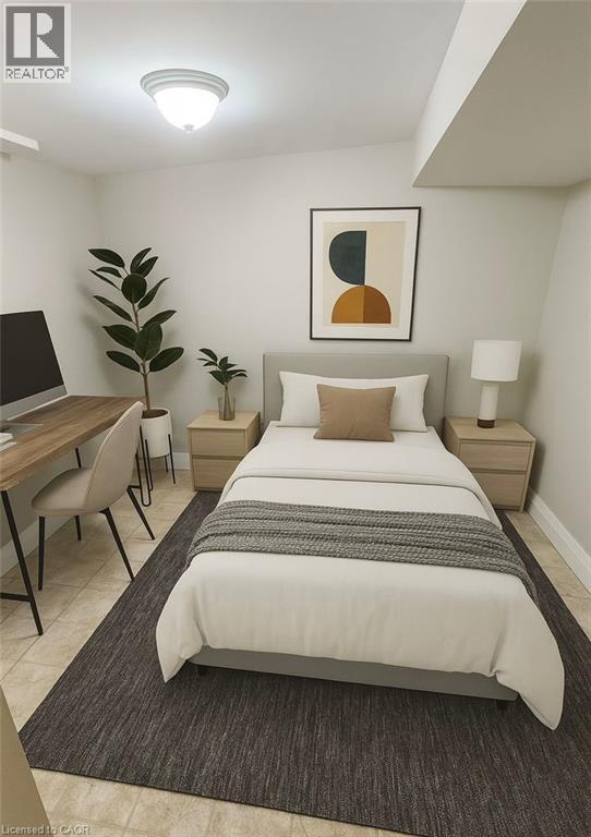 A bedroom with a bed, desk, and chair.