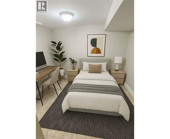 A bedroom with a bed, desk, and chair.
