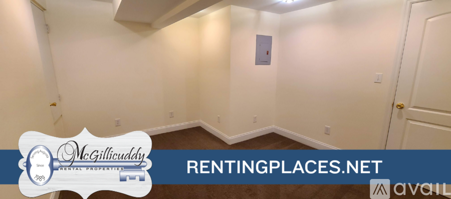 A room with McGillcuddy's logo and RentingPlaces.net on the wall.