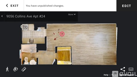 A digital image of a room layout with a door and a red circle on the floor.