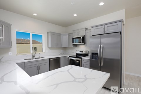 A modern kitchen with a large island in the middle.