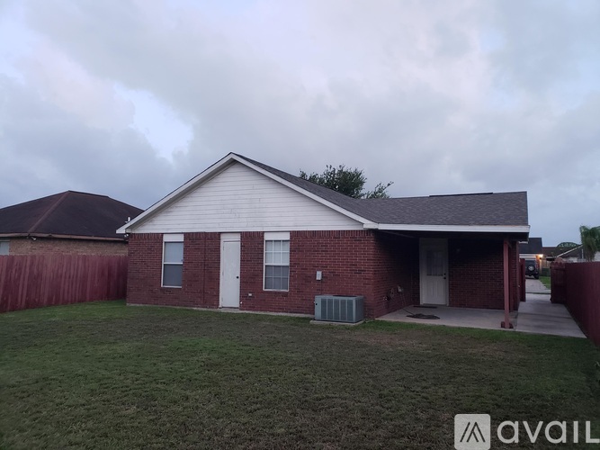 A house with a red brick exterior and a white door is available for purchase.