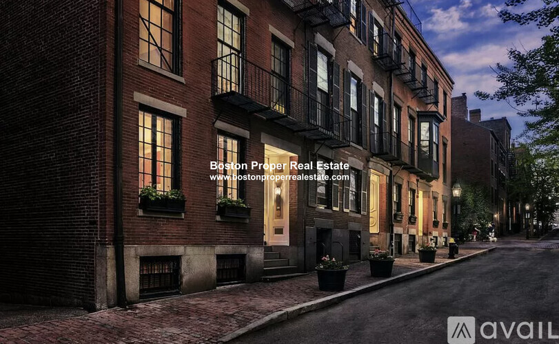 A street view of a building with the text "Boston Prepper Real Estate" and a website address.