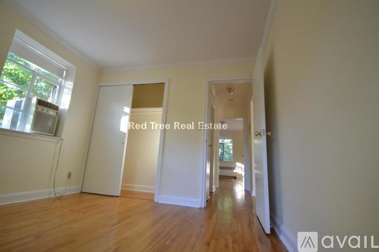 A room with a Red Tree Real Estate sign on the wall.