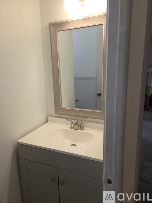 A bathroom sink with a mirror above it.