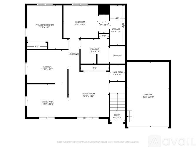 A floor plan of a house with a primary bedroom, laundry, and a half bath.