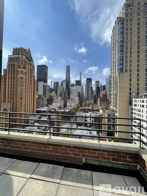 A cityscape with tall buildings and a clear sky.