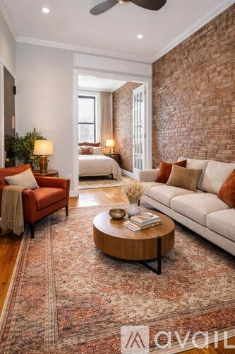 A living room with a red couch and a coffee table.