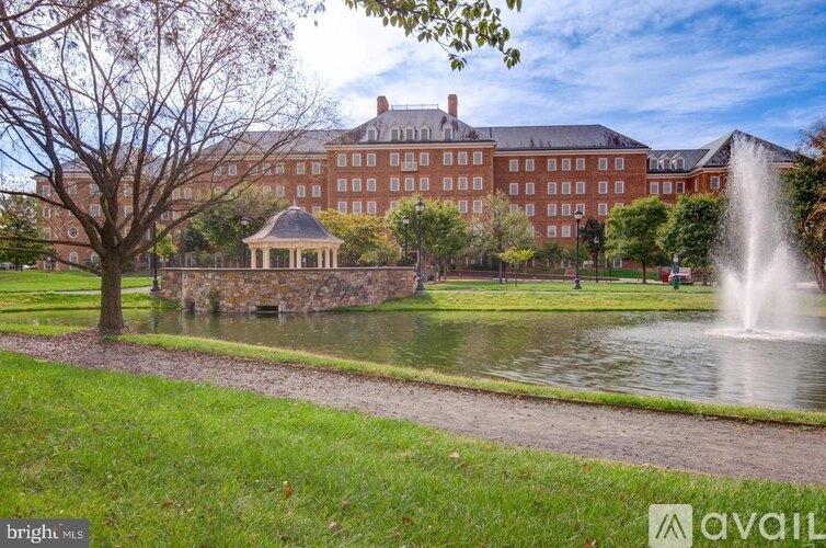 A large building with a fountain in front of it.