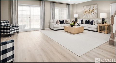 A modern living room with a checkered sofa and a wooden coffee table.