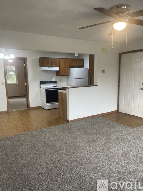 A kitchen with a refrigerator, stove, and oven.