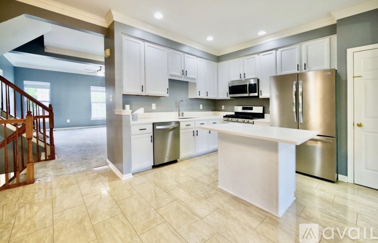 A kitchen with a large island in the middle of the room.