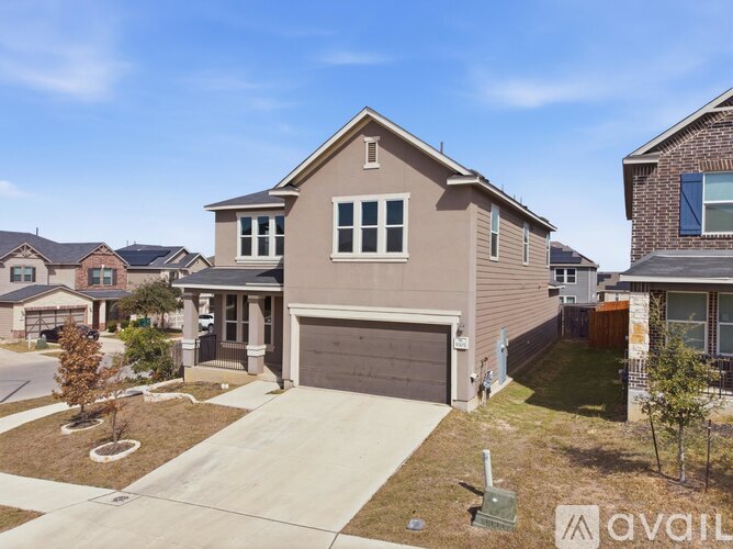 A house with a garage is for sale.